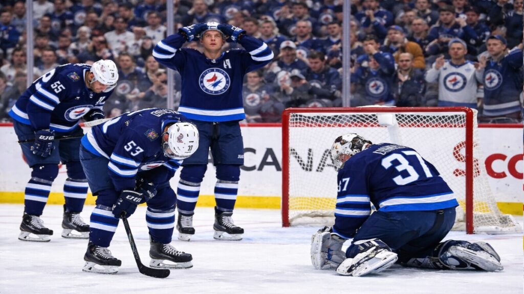 Winnipeg Jets players react after conceding late goal against Golden Knights